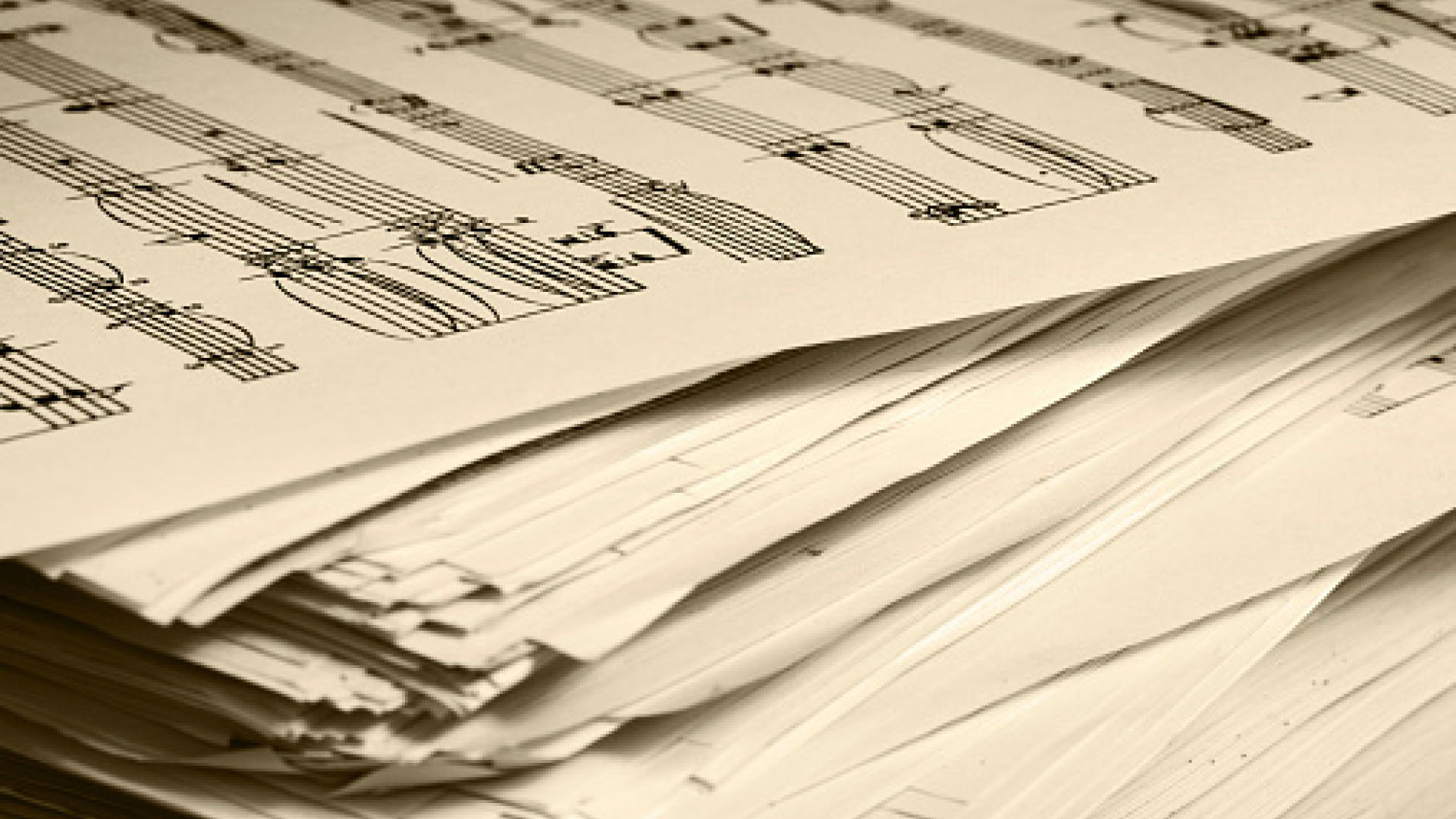A stack of sheet music papers