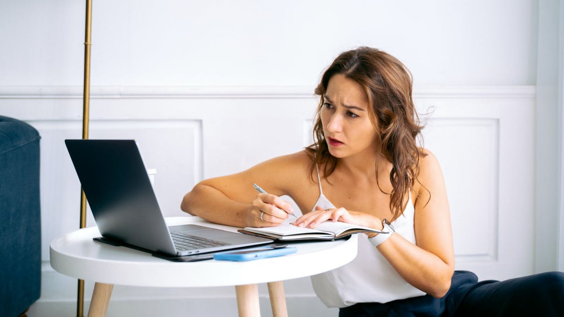 A woman confused at her laptop