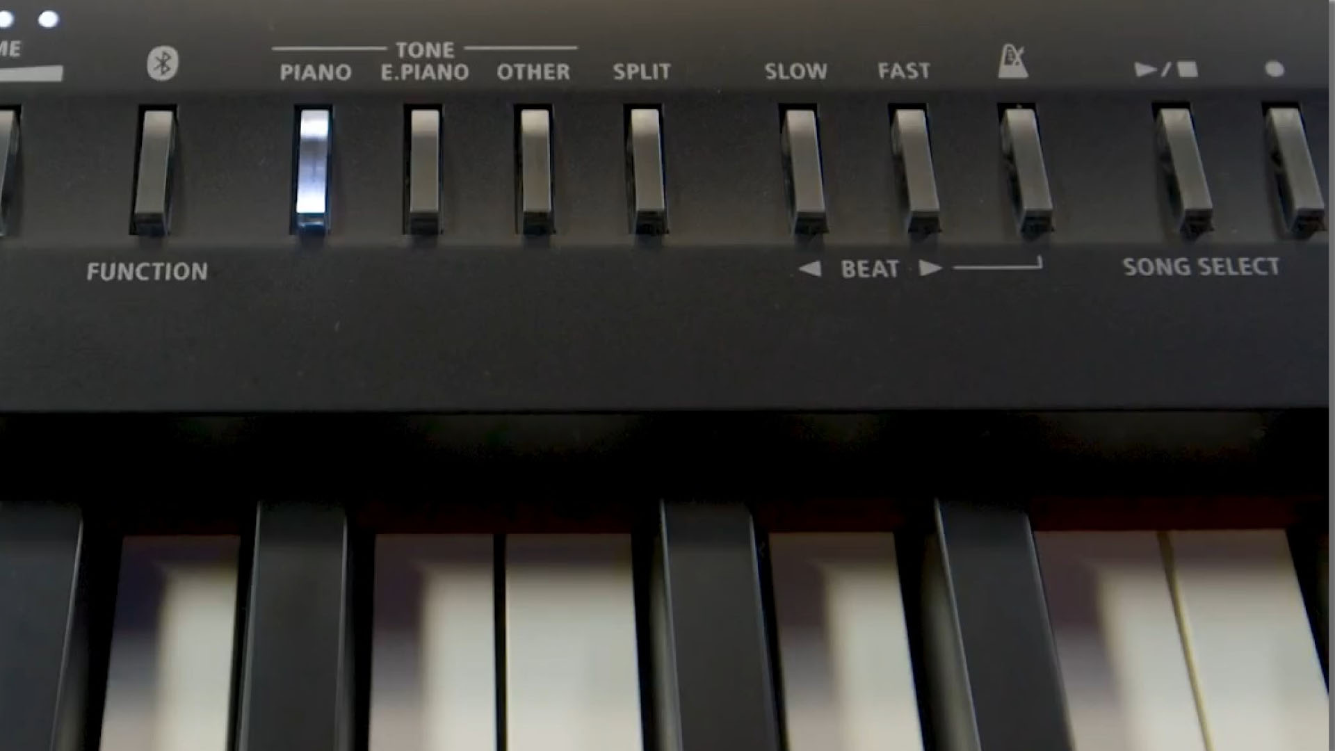 A digital piano with mechanical buttons